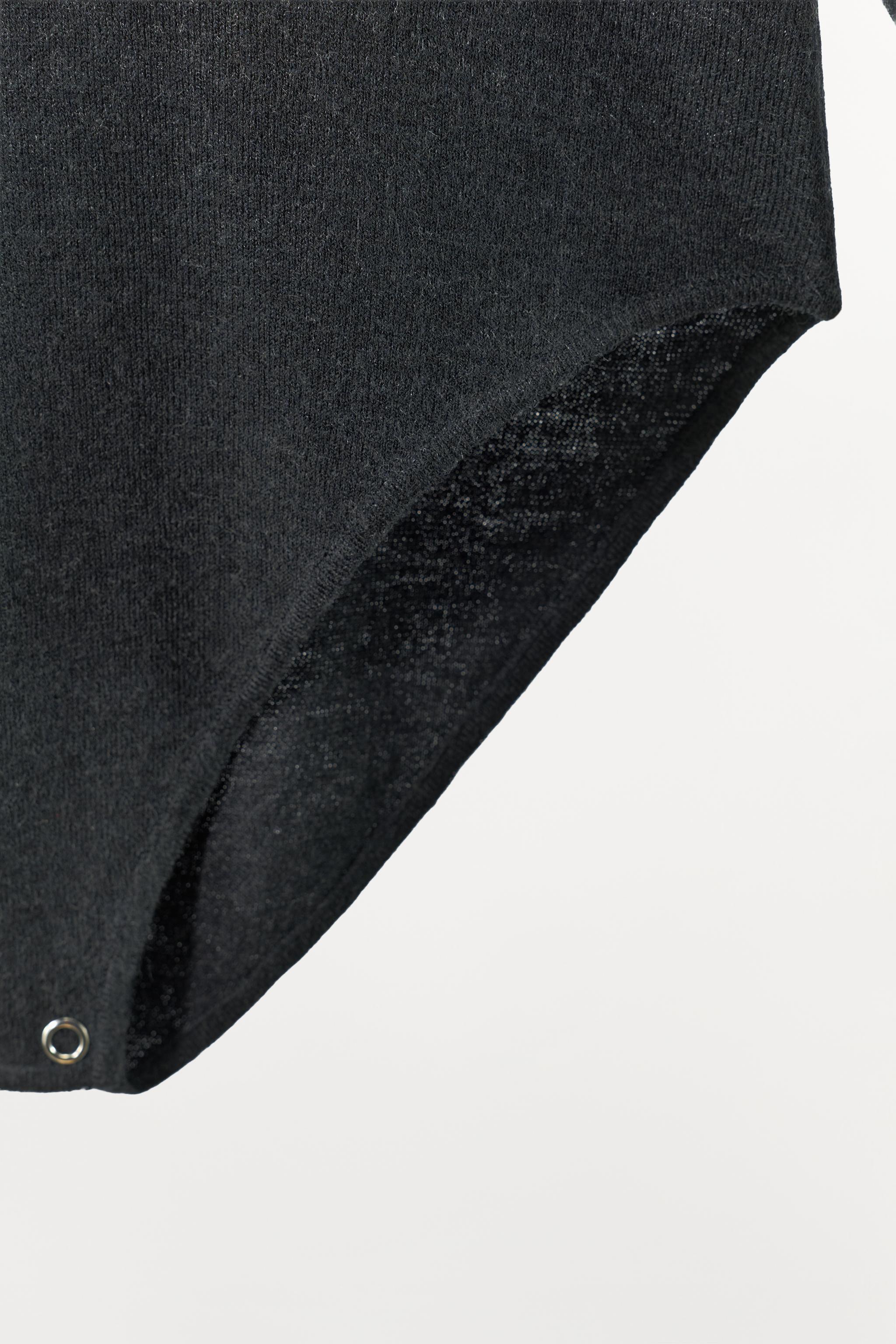 SHOULDER PAD KNIT BODYSUIT